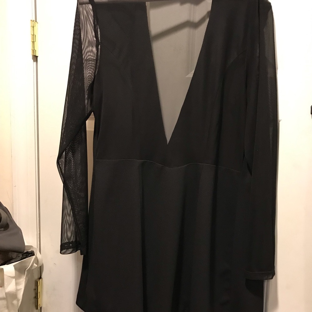 Black blazer. Sheer sleeves and sheer back